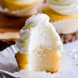 These wedding cake cupcakes are so good, you won't want to save them for weddings only. Make these moist, fluffy cupcakes with whipped buttercream any time!