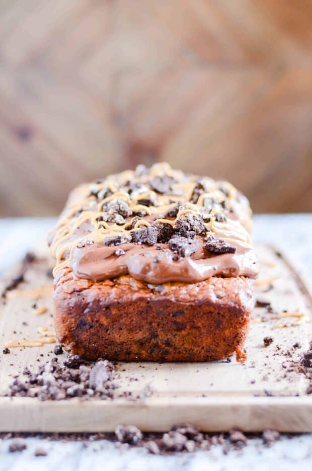 Triple the peanut butter in this sweet banana bread with a decadent cookies & cream packed ganache on top!