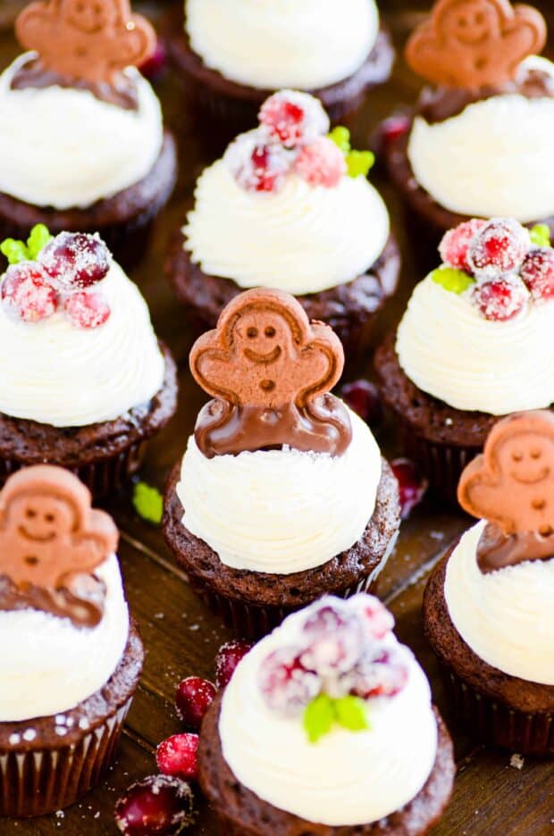 Chocolate gingerbread cupcakes with an easy-to-pipe cream cheese frosting. These spiced cupcakes are super fudgy and and perfect for the holidays. Plus they start with a mix!