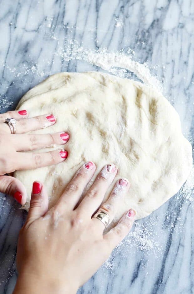 This quick and easy bread dough is ready in way less than 20 minutes. It's perfect for pizza crusts, cinnamon rolls, and even dinner crescent rolls when you're in a pinch for time!