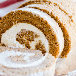 This soft carrot cake roll is soaked in caramel sauce and swirled with a fluffy whipped cream cheese frosting. A total showstopper for your Easter table this year!