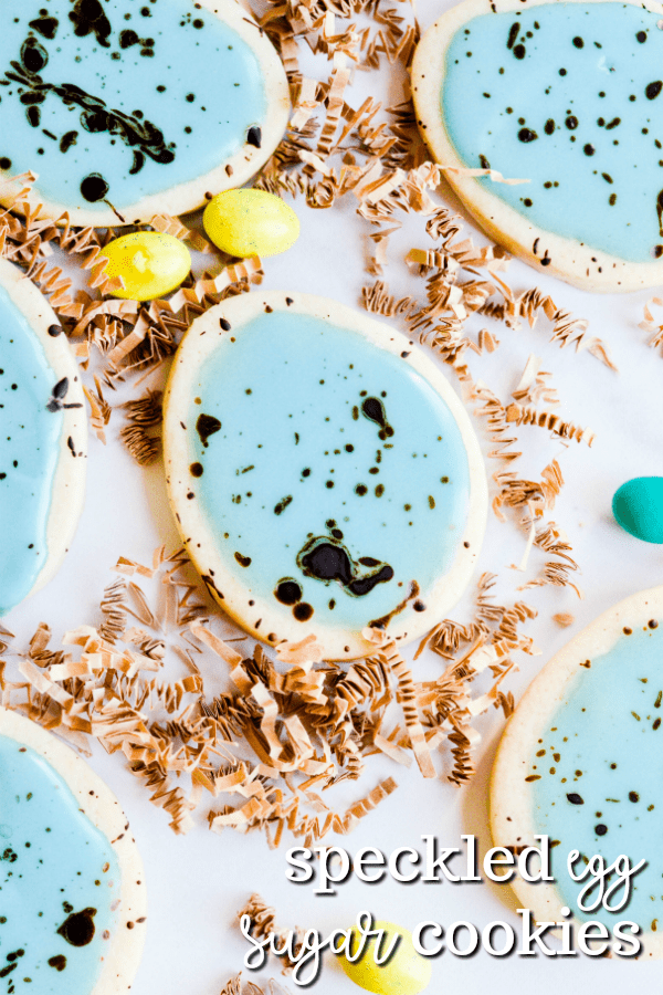 Soft cut-out sugar cookies that hold their shape, simple icing, and a cocoa splatter that makes these Easter Egg Sugar Cookies look speckled!
